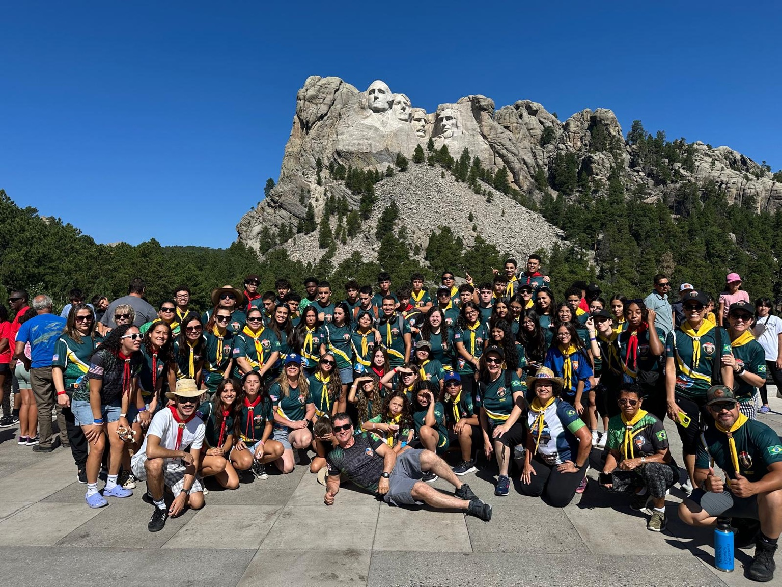 A large community group gathered together during a service trip at Mount Rushmore